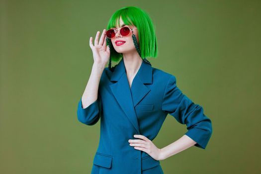 pretty woman green hair blue jacket sunglasses. High quality photo