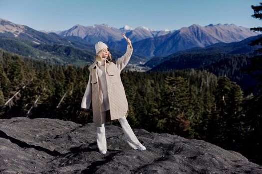 woman autumn style travel to the mountains forest nature lifestyle. High quality photo