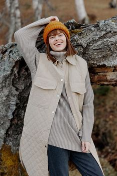 portrait of a woman in an orange hat nature autumn Autumn walk. High quality photo