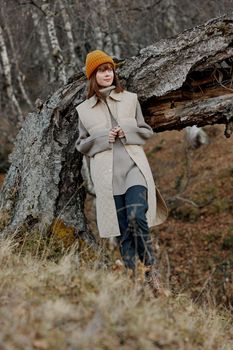 portrait of a woman in autumn clothes nature trees travel landscape. High quality photo