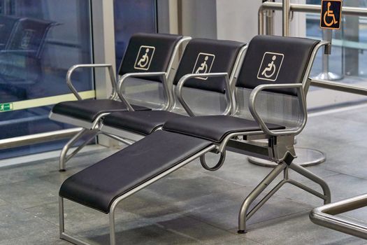 Places for people with disabilities in a public place. Chairs for disabled people in the waiting room