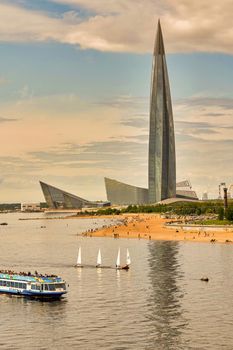 Ships sail against the backdrop of Lakhta Center skyscraper on the shores of the Gulf of Finland in St. Petersburg, Russia.