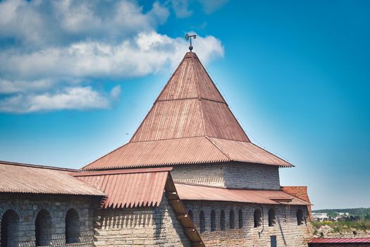 View of the old stone fortress with a watchtower. Fortress Oreshek on a sunny summer day