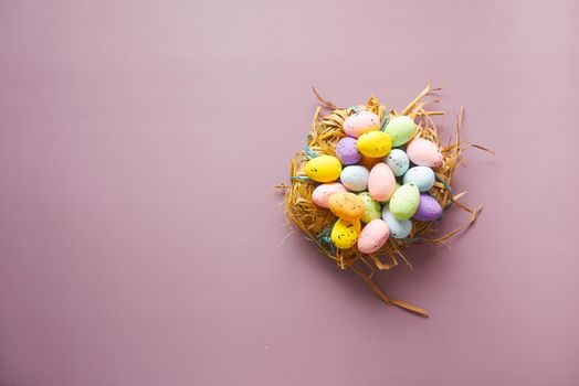 top view of easter eggs on purple background ,
