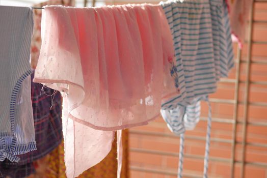 child clothes line filled with hanging trousers.