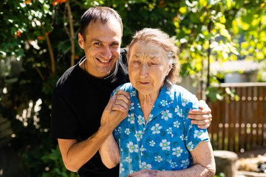 very old great-grandmother and adult grandson