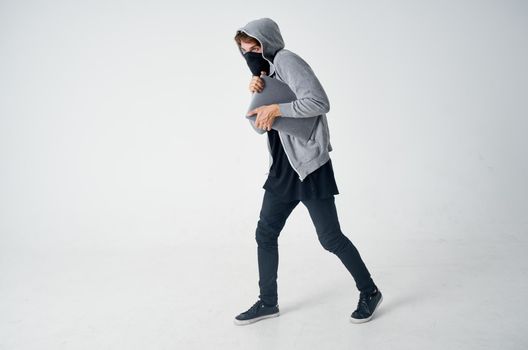 male thief stealth technique robbery safety hooligan isolated background. High quality photo