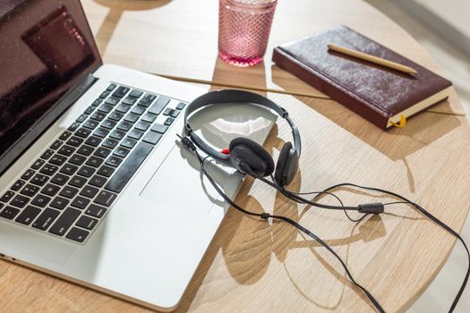 Laptop on table, home interior.