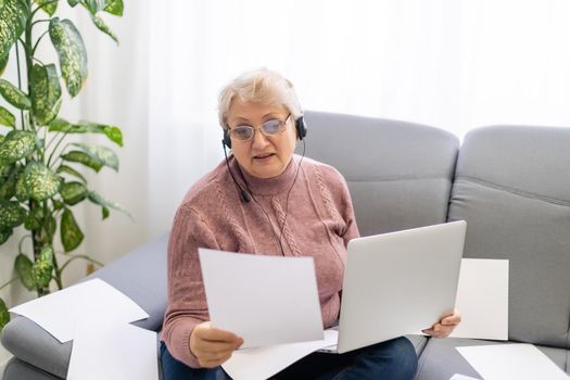 A Elderly woman worry about bill notice at home