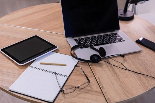 laptop with tablet and smart phone on table