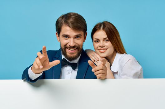 funny man and woman billboard marketing fun emotions isolated background. High quality photo