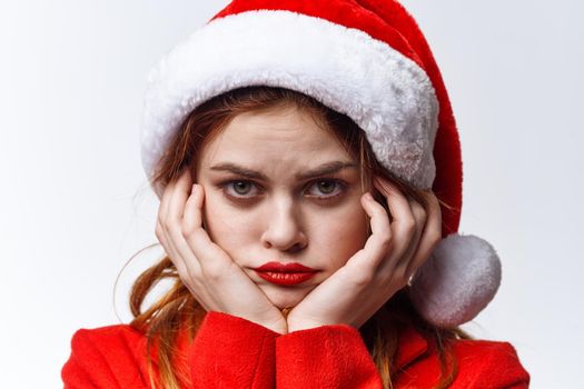 woman in santa hat red lips emotions posing holiday. High quality photo