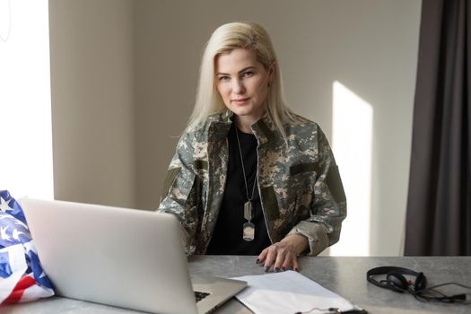 female soldier video chatting with family.