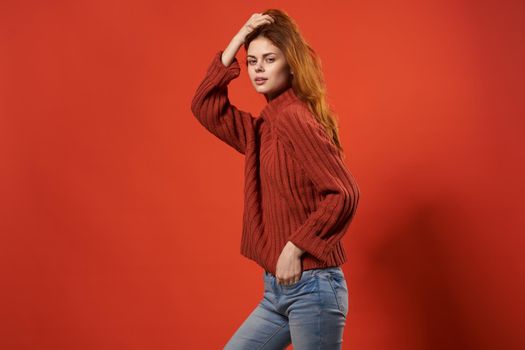 woman in a red sweater beautiful hairstyle fashion lifestyle close-up. High quality photo