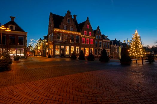 Historical city Dokkum in christmas time in the Netherlands at sunset
