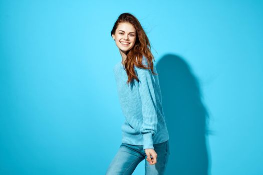 portrait of a woman fashion posing blue background Lifestyle. High quality photo