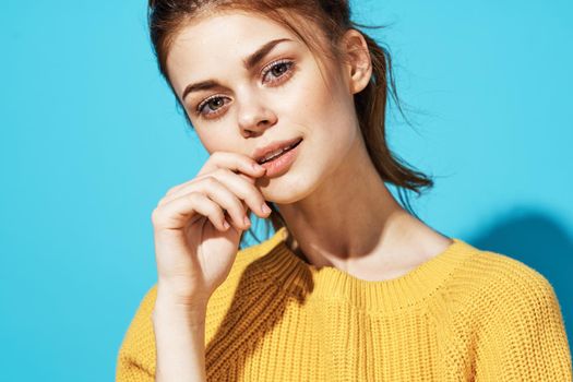 woman in yellow sweater fashion posing glamor close-up. High quality photo