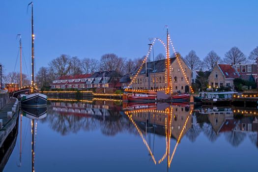 Historical city Dokkum in christmas time in the Netherlands at sunset