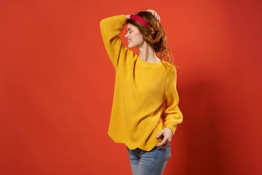 cheerful woman in yellow sweater studio fashion decoration. High quality photo