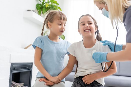 young doctor with little girl patient feeling bad medical inspection with stethoscope