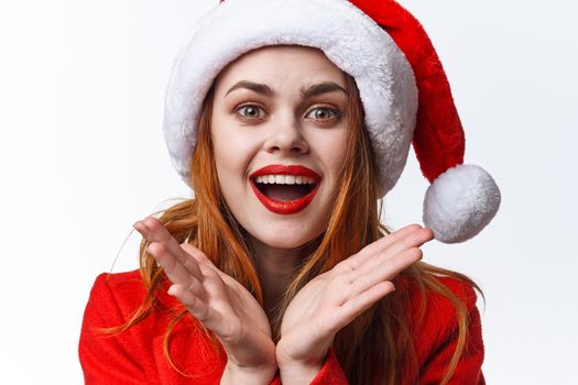 woman in santa hat posing emotions studio christmas. High quality photo