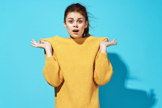 woman in yellow sweater posing fashion lifestyle studio. High quality photo