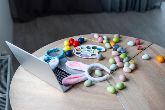 Easter colorfull eggs and laptop still life.