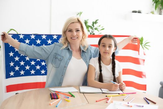 Mother and daughter with American Flag