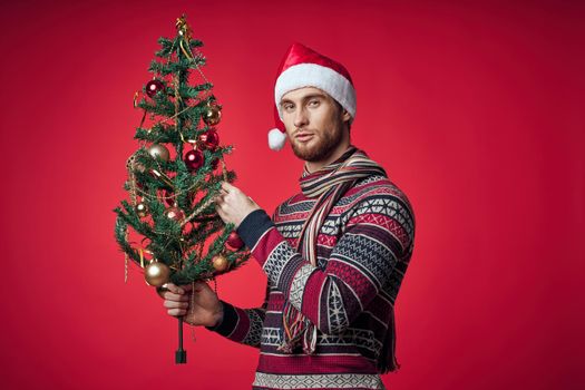 man in a sweater Christmas holiday Christmas tree decoration. High quality photo