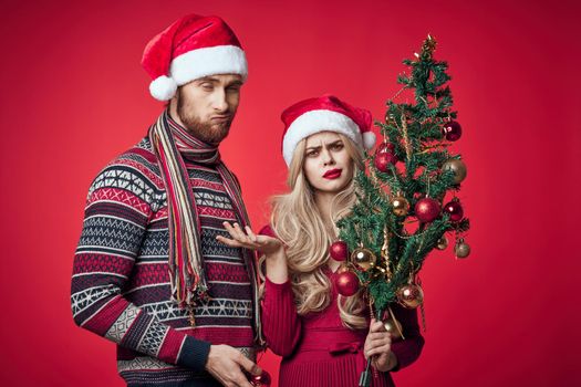 emotional young couple celebrating christmas decoration together. High quality photo