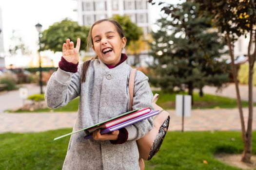 little girl with a backpack going to school.