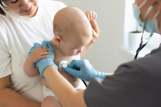 doctor with newborn on a white.