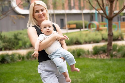 Mother with baby at outdoors.