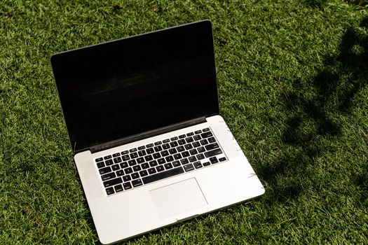 Laptop on the garden, close-up