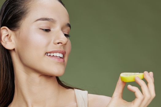 young woman lemon vitamins health cosmetology close-up Lifestyle. High quality photo