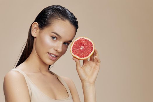 brunette grapefruit vitamins health cosmetology close-up Lifestyle. High quality photo