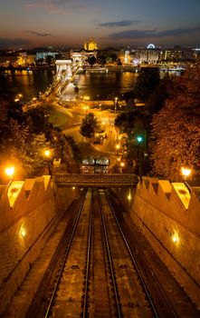 Aerial cityscape view with illuminated chain bridge and funicular railway during the twilight in Budapest, Hungary
