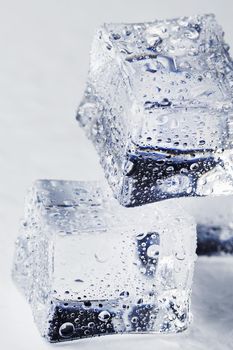 Blocks of Ice With water Drops close-up. Macro ice refreshing cube for a drink on a hot day