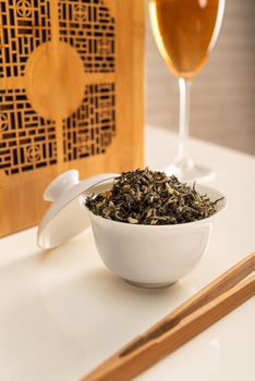 tea table with appliances and wine glasses, in which large-leaf tea is brewed