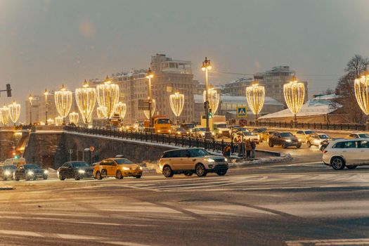01.22.2022 Moscow, Russia. Bolshoi Moskvoretsky Bridge on a winter snowy night