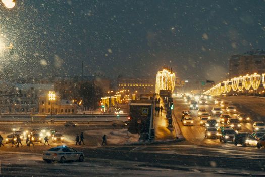 01.22.2022 Moscow, Russia. Night winter Moscow in the snow. Big Moskvoretsky bridge across the Moscow river decorated for the New year.