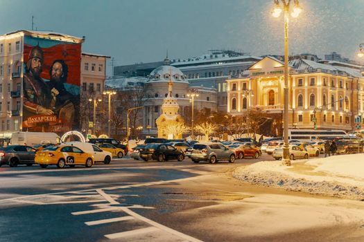 01.22.2022 Moscow, Russia. road traffic during a winter snow storm in the center of Moscow along Znamenka street.