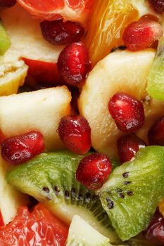 Pieces of raznfh fruit close-up in full screen, Fruit salad. Slices of fresh and healthy fruits for a healthy diet.