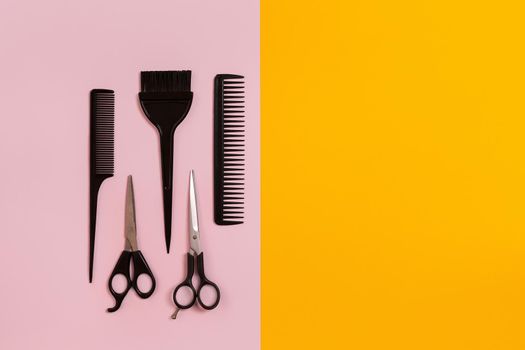 Combs and hairdresser tools on color background top view. Copy space. Flat lay. Still life. Mock-up