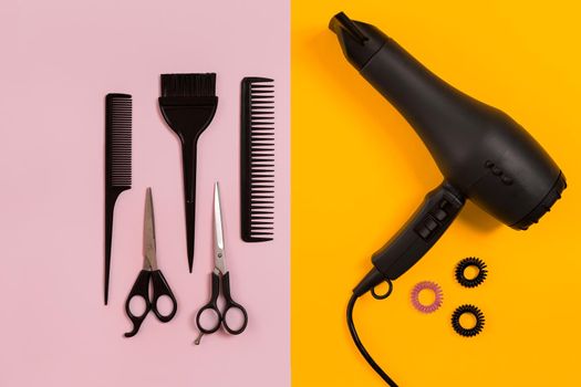 Combs and hairdresser tools on color background top view. Copy space. Flat lay. Still life. Mock-up