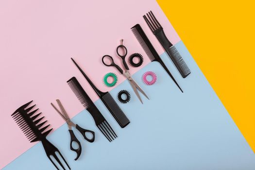 Hairdresser tools on a colored background with copy space. Top view. Still life. Mock-up. Flat lay