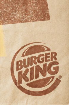 Russia, Moscow - May 17, 2021: Paper bag with Burger King logo. Burger King is a global fast food hamburger chain with headquarters worldwide.