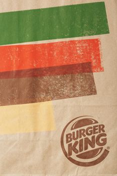 Russia, Moscow - May 17, 2021: Paper bag with Burger King logo. Burger King is a global fast food hamburger chain with headquarters worldwide.