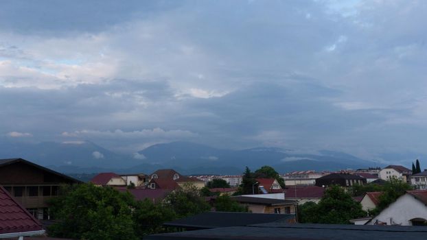 SOCHI, RUSSIA - JUNE, 06, 2021: Mountain view near Sochi Adler, outskirts of the city . Cloudy day in the south of Russia