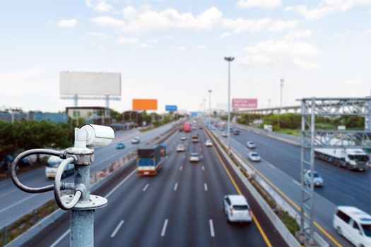 CCTV cameras on the overpass for recording on the road for safety and traffic violations.